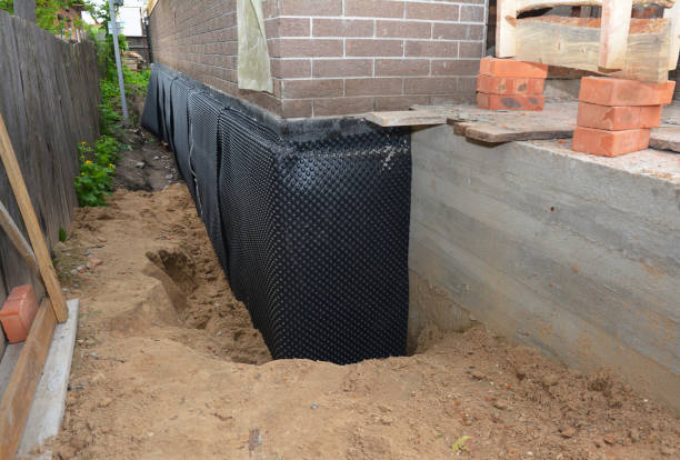 Happy homeowners after waterproofing job in Union Furnace